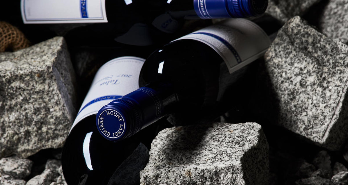 Bottles of Mount Langi Ghiran wine lying among granite rocks